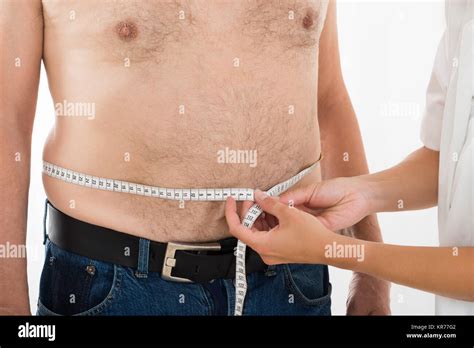 Doctor Measuring Person S Waist Stock Photo Alamy