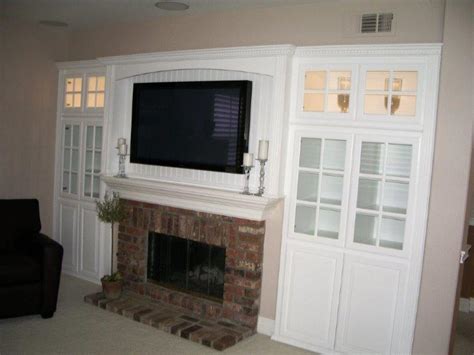 A flat wall fireplace takes up no floor space within your home. TV Over Fireplace - Woodwork Creations