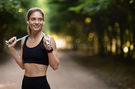 slim athletic woman having workout outdoors holding skipping rope stock image image of