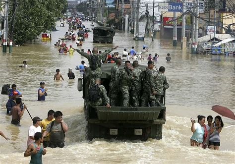 Philippine Typhoons Kill 59 Floods Trap Hundreds