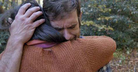 Sad Man Hugging A Woman Helping Him To Get Through Some Hard Times