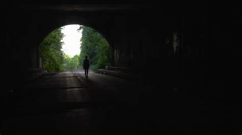 Girl Walking Down Dark Tunnel Stock Video Footage Storyblocks