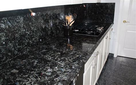 It's a durable granite recommended for kitchen counters or bathroom countertops. volga-blue-granite-kitchen | Blue granite, Blue granite ...