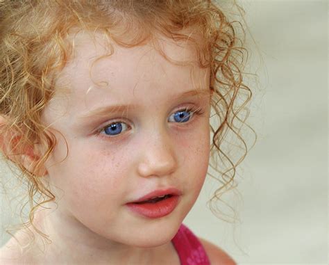 A Little Girl With Big Blue Eyes Photograph By Derrick Neill