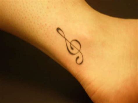 A guitar among the vines. 30 Most beautiful small and cute tattoos every girl want