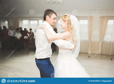 First Wedding Dance Of Newlywed Couple In Restaurant Stock Image