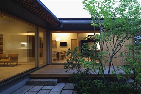 Timber Framed Japanese House Built Around Private Gardens