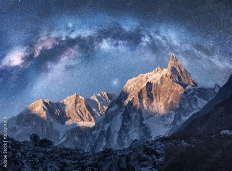 Fototapeta Arched Milky Way Over The Beautiful Mountains At Night In