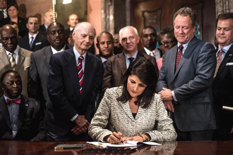 South Carolina Gov Nikki Haley Signs A Bill To Remove The Confederate Battle Flag From The