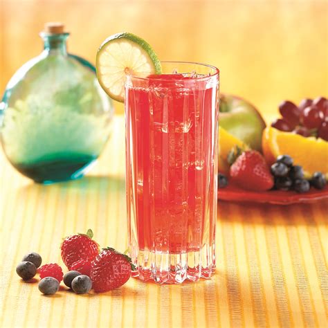 Orange liqueur combine ingredients in a pitcher with ice. Fulfill Mixed Berry Fiber Drink - NuYou