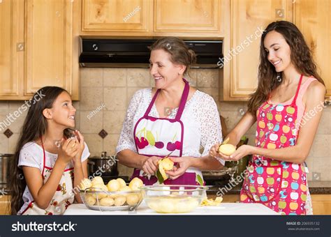 Group Portrait Of Happy Smiling Mother And Daughter Cooking Dinner Preparing Food Isolated