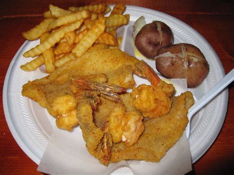 Although this fish is inexpensive, or free if you live near a river or pond, it often carries undesirable characteristics such as a fishy or even muddy taste. #1 Plate: fried catfish and fried jumbo shrimp with sides ...