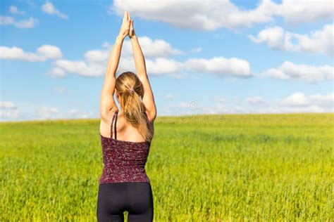 Young Woman Yoga Stretching Rear View Stock Image Image Of Meadow