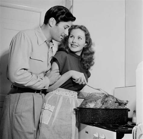 jeanne crain and her husband paul brinkman cooking a large turkey at home 1955 jeanne crain