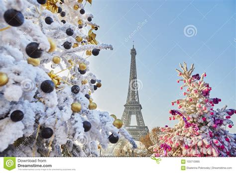 Christmas Tree Covered With Snow Near The Eiffel Tower In Paris Stock