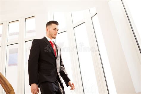 Portrait Of Young Businessman Walking On Stair Stock Image Image Of