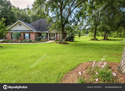 Colonial House With Large Yard Stock Photo By ©tallypic 292224510