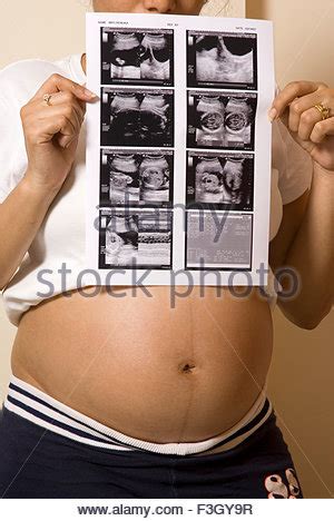 South Asian Indian Pregnant Lady Touching Her Belly For Feeling Baby
