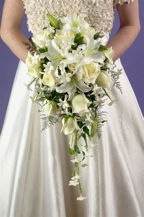Your bridal flowers are such an important part of your wedding day, so it's important to pick a type of bouquet that will complement your overall look and theme. Cascade Bridal Bouquet | This bouquet features flowers ...
