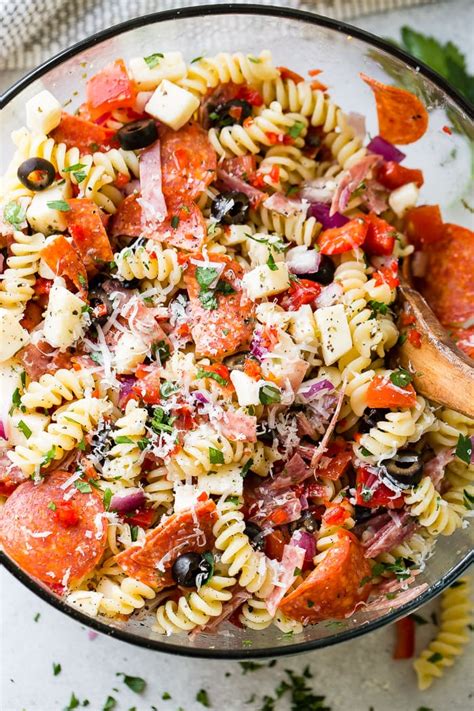 If you make this in advance, reserve a bit of the dressing to add right before serving, as the pasta has a tendency to soak up the dressing as it sits over. Easy Italian Pasta Salad - Oh Sweet Basil