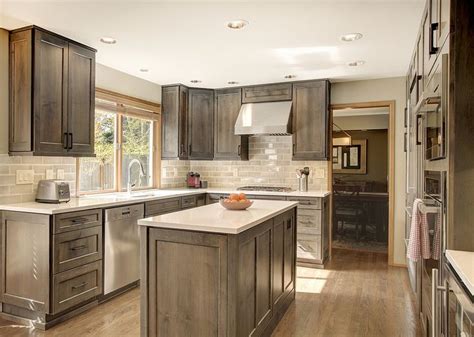 Dark gray, brown, and white the leather brown floors paired with the oslo gray cabinets work great in this kitchen because of its abundant natural lighting. Image result for classic kitchen stained cabinets subway ...