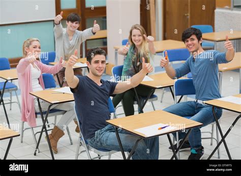 Students In Classroom Giving Thumbs Up Stock Photo Alamy