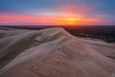 Photo du lever du soleil sur la Dune du Pilat après la tempête Marcel Dune du pilat