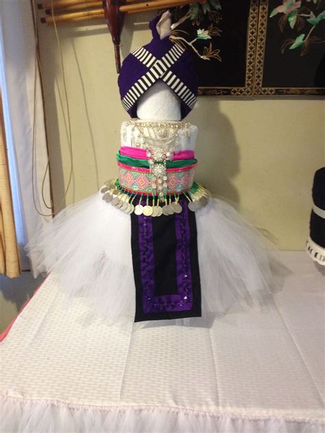 During the new year's celebration, hmong dress in traditional clothing and enjoy hmong. Hmong Cake Towel … | Hmong clothes, Hmong wedding, Hmong