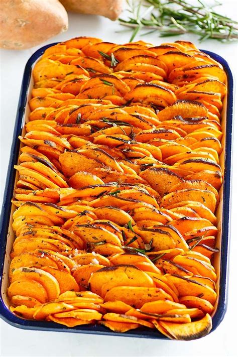 Thinly Sliced And Baked Sweet Potatoes Nicely Stacked On A Baking Tray