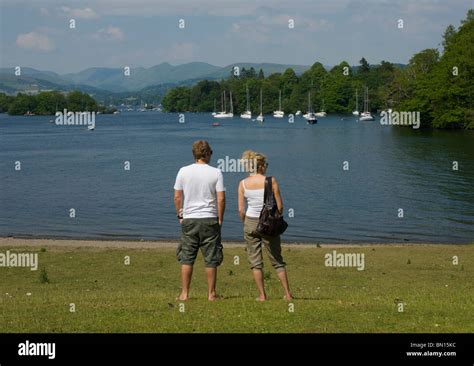 Couple Gazing Across Lake Windermere Lake District National Park Cumbria England Uk Stock