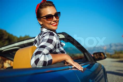 Beautiful Pin Up Woman Sitting In Cabriolet Enjoying Trip On Luxury