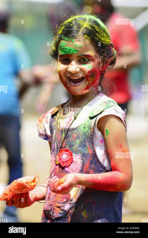 Colorful Face Of A Girl Playing Holi Festival Of Colours Pune