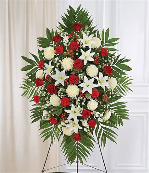 Pink roses stand for love, grace and appreciation and are usually given to the bereaved. Red & White Sympathy Standing Spray at From You Flowers