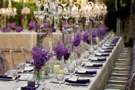 Crystal Chandeliers And Beautiful Purple Centerpieces