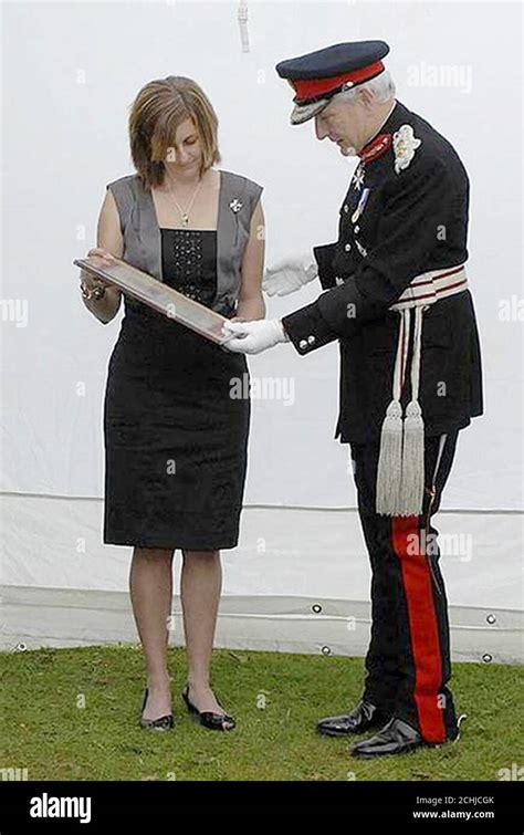 Karen Upton The Wife Of Warrant Officer Sean Upton Is Presented With