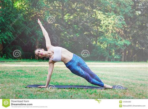 Slim Woman Practicing Yoga In Nature Vasisthasana Exercise Stock