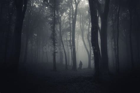 Ghost In A Dark Scary Mysterious Forest On Halloween Stock Photo