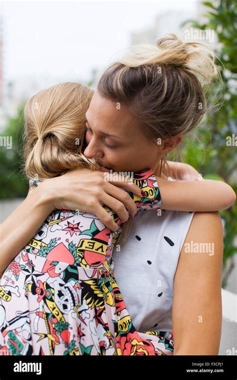 Mother Embracing Young Daughter Stock Photo Alamy