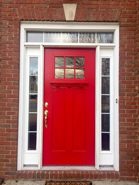 A Red Front Door On A Brick Building
