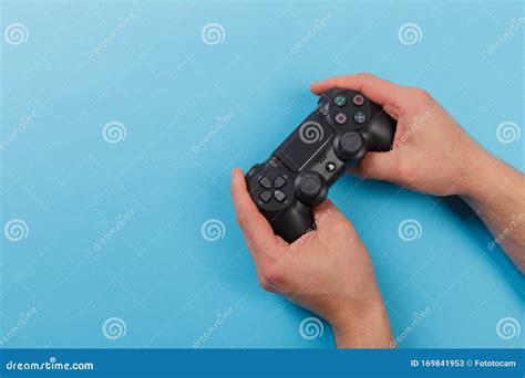 Russia Oktober 24 2019 Male Hands Holding A Ps4 Controller Sony