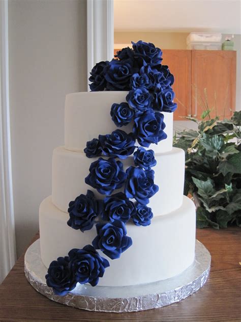Since the dots are such a timeless and versatile element that can be dressed up or dressed down for any type of theme or setting, it's the cake stand and topper that really inform the style. Cascading Sugar Roses Wedding Cake - CakeCentral.com