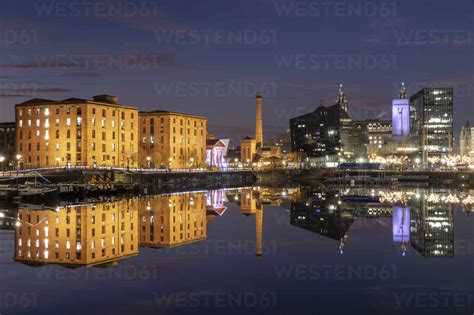 The Albert Dock Pumphouse And Liverpool Waterfront Reflected In