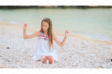 Cute Little Girl At Beach During Nature Stock Photos Creative Market