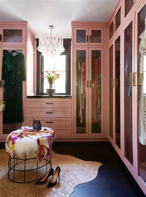 Glam Pink Walk In Closet Boasts Pink Built In Wardrobe Cabinets Over A