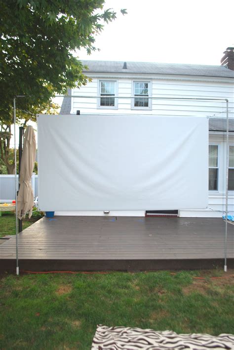 They're available in many of our materials and come with reinforced edges and grommets that let you bungee your diy projection screen to a wall, frame, or truss system. DIY OUTDOOR MOVIE SCREEN AND STAND - Effortless Style Blog