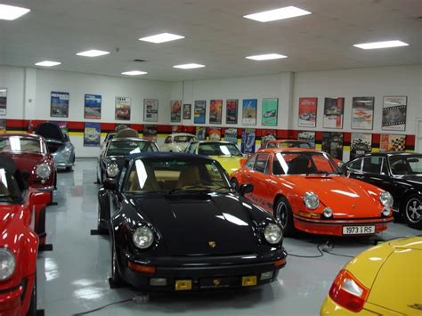 The painted wall combined with the tiles makes the garage look like it was finished professionally! Can you say Porsche collector?? | Garages, Garage pictures ...