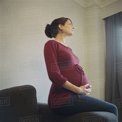 Pregnant Woman Looking Away Stock Photo Dissolve