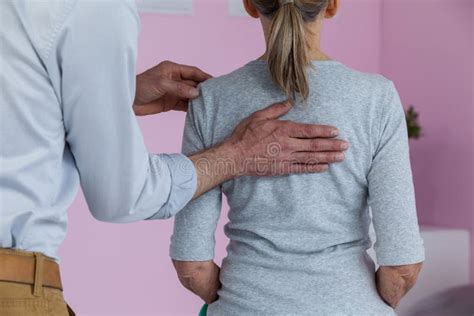 Physiotherapist Giving Neck Massage To Female Patient Stock Image Image Of Orthopedic