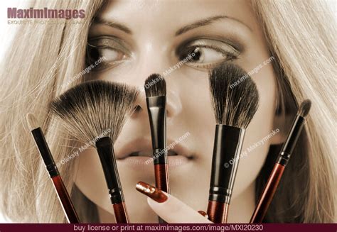 Beautiful Young Woman With Make Up Brushes Stock Photo Mxi20230