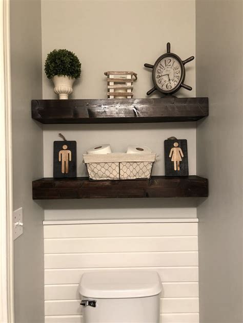 How to make narrow floating shelves perfect for a bathroom above a toilet and for around $20 you can make a set of 3! Shiplap behind the toilet with espresso wood shelves above ...